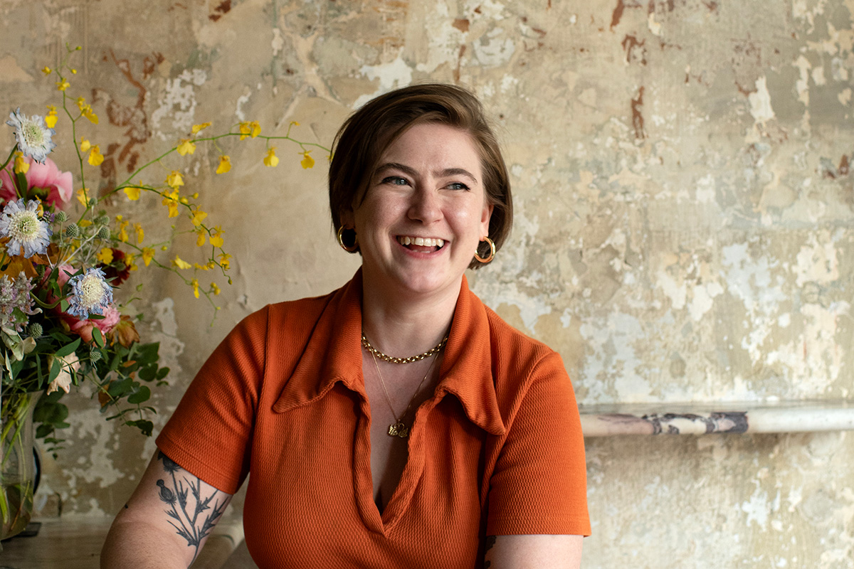 Photo of&nbsp;Rachel Jackson &rsquo;11. She smiles at the camera in an orange shirt.; Read More in the New York Times