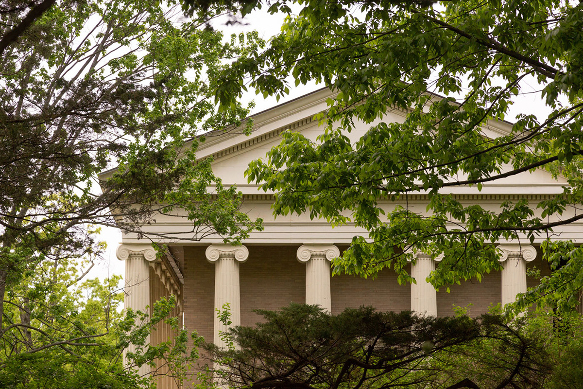 The exterior of the Stevenson Library at Bard College, green trees surrounding the facade of the building.; Read More on Inside Higher Ed