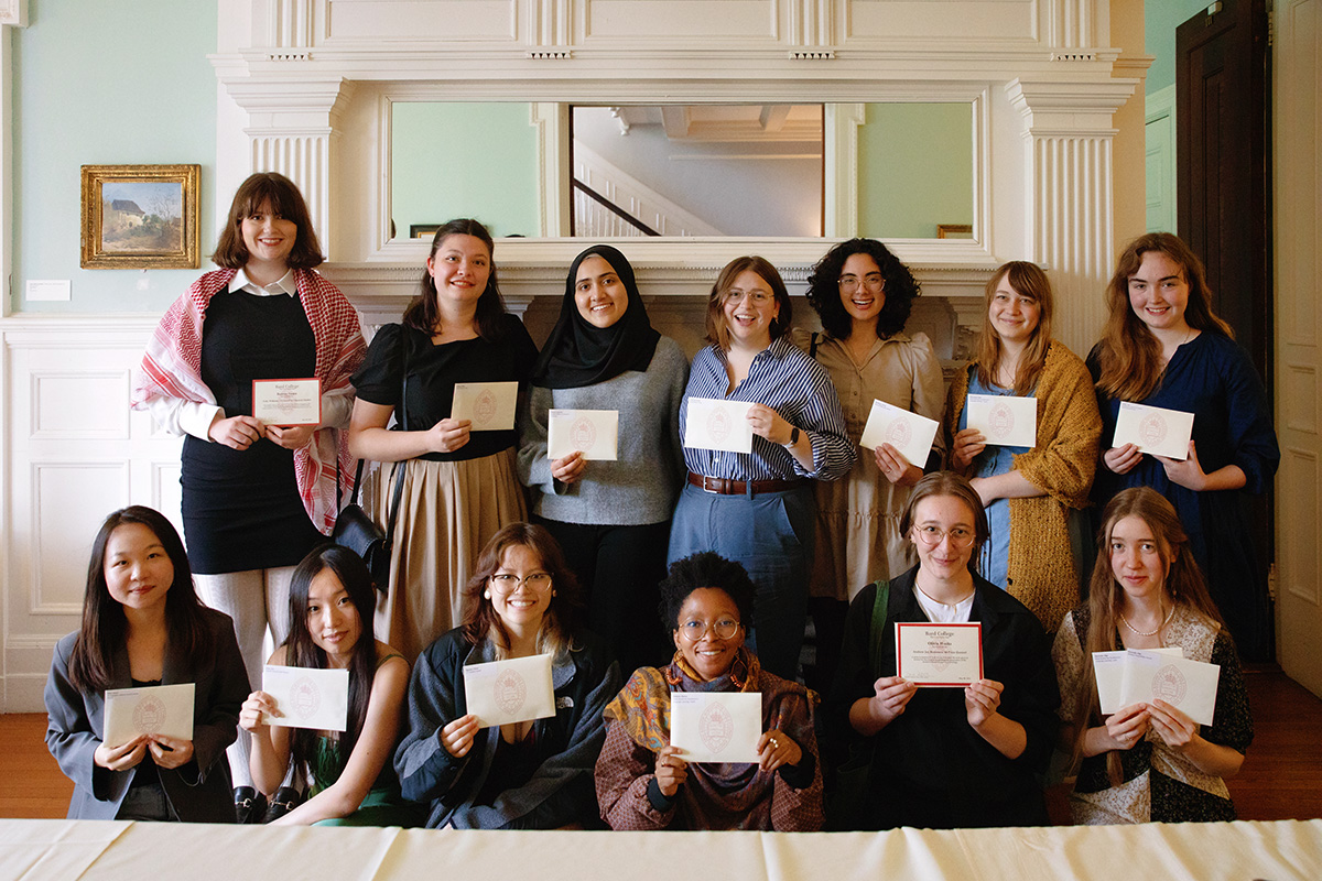 A group of students smiling at the camera, all of them holding a certificate.; Bard College Celebrates Student Achievements at Undergraduate Awards Ceremony