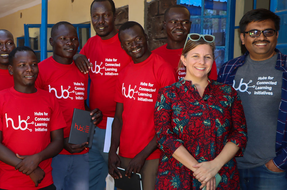 Associate Vice President for Global Initiatives Rebecca Granato ’99 (second from right) poses with students and staff at the Hubs Refugee Higher Education Access Program launch in 2022. Photo by Moris Albert, courtesy Open Society University Network
