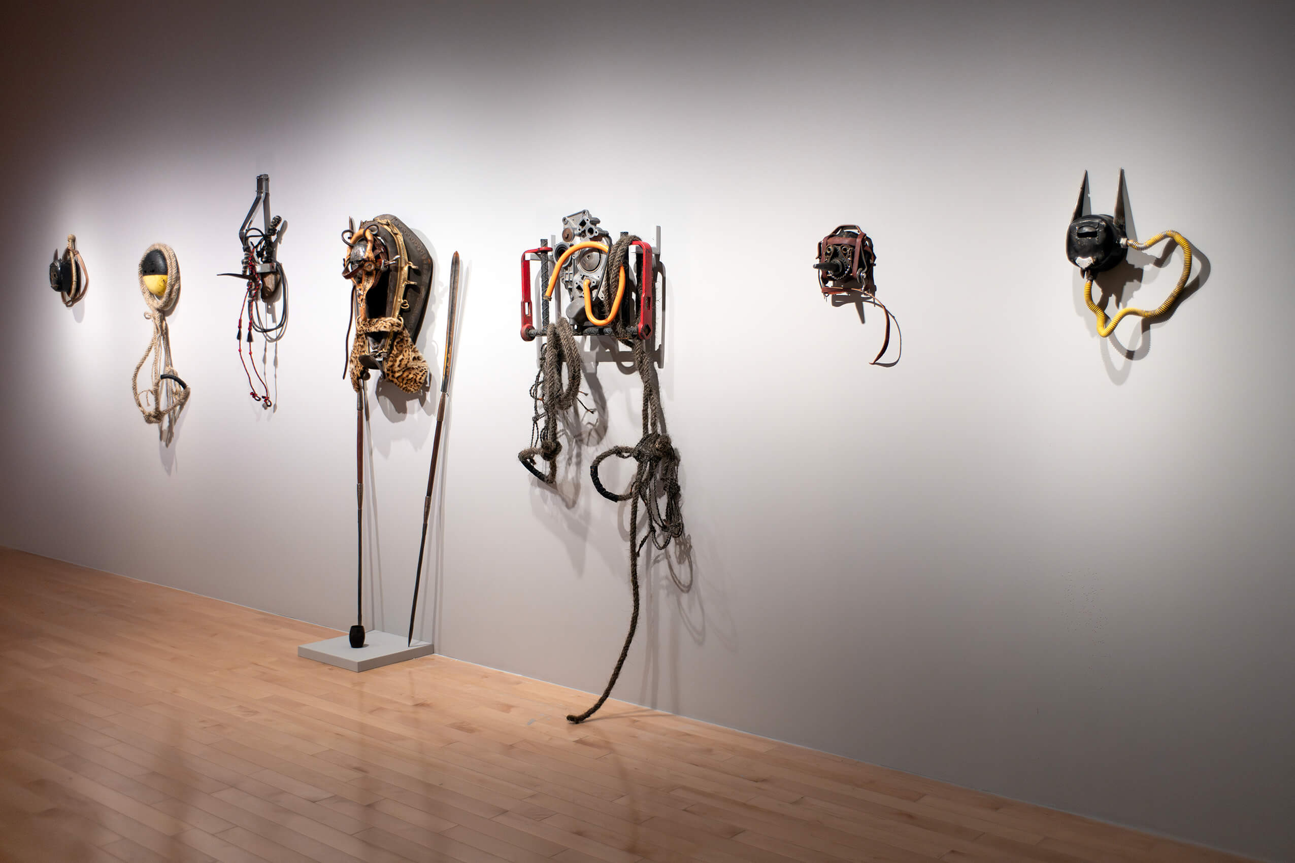 seven of Gardea's masks on a gallery wall.