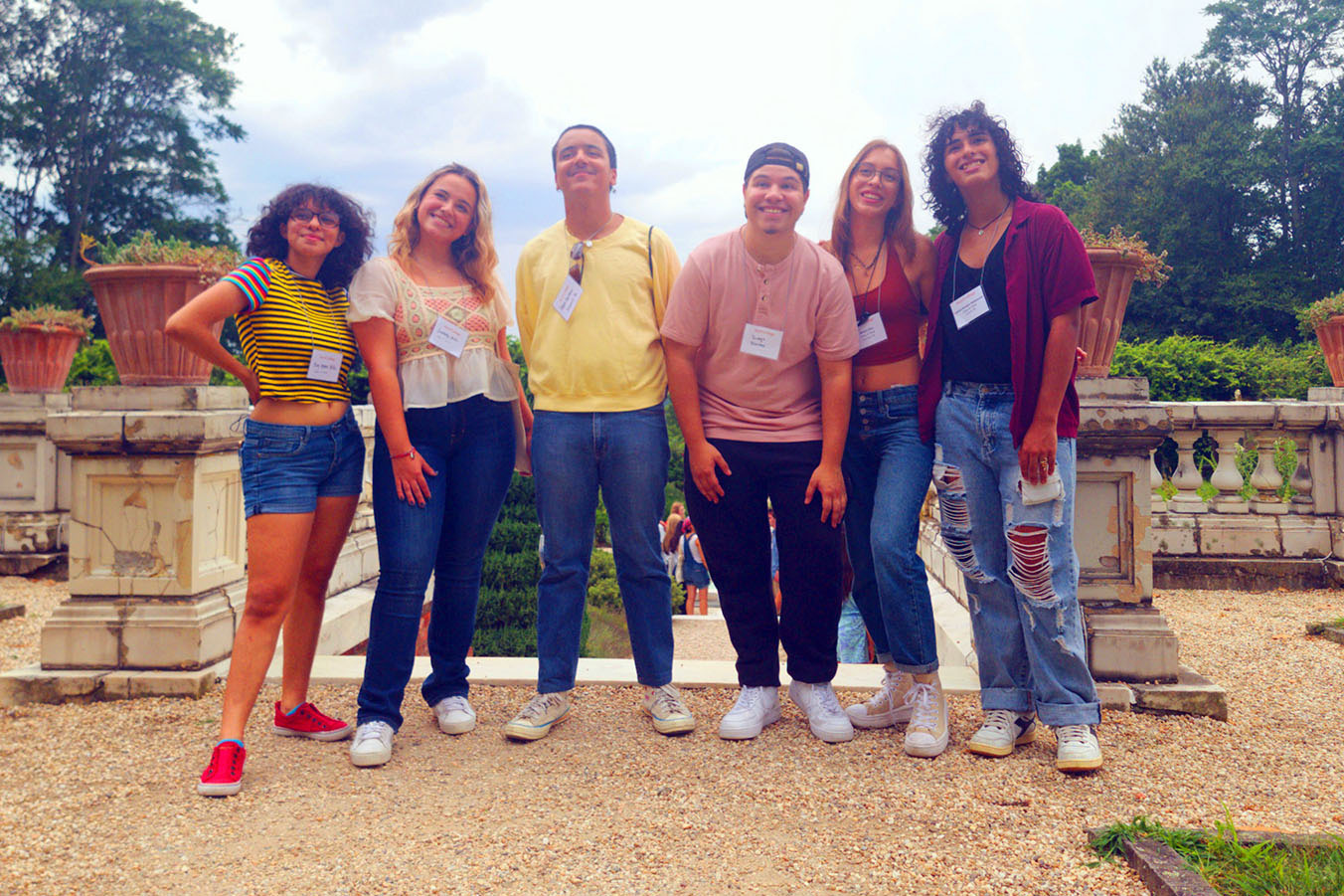 Five students standing in a line in front of Blithewood Garden at Bard.