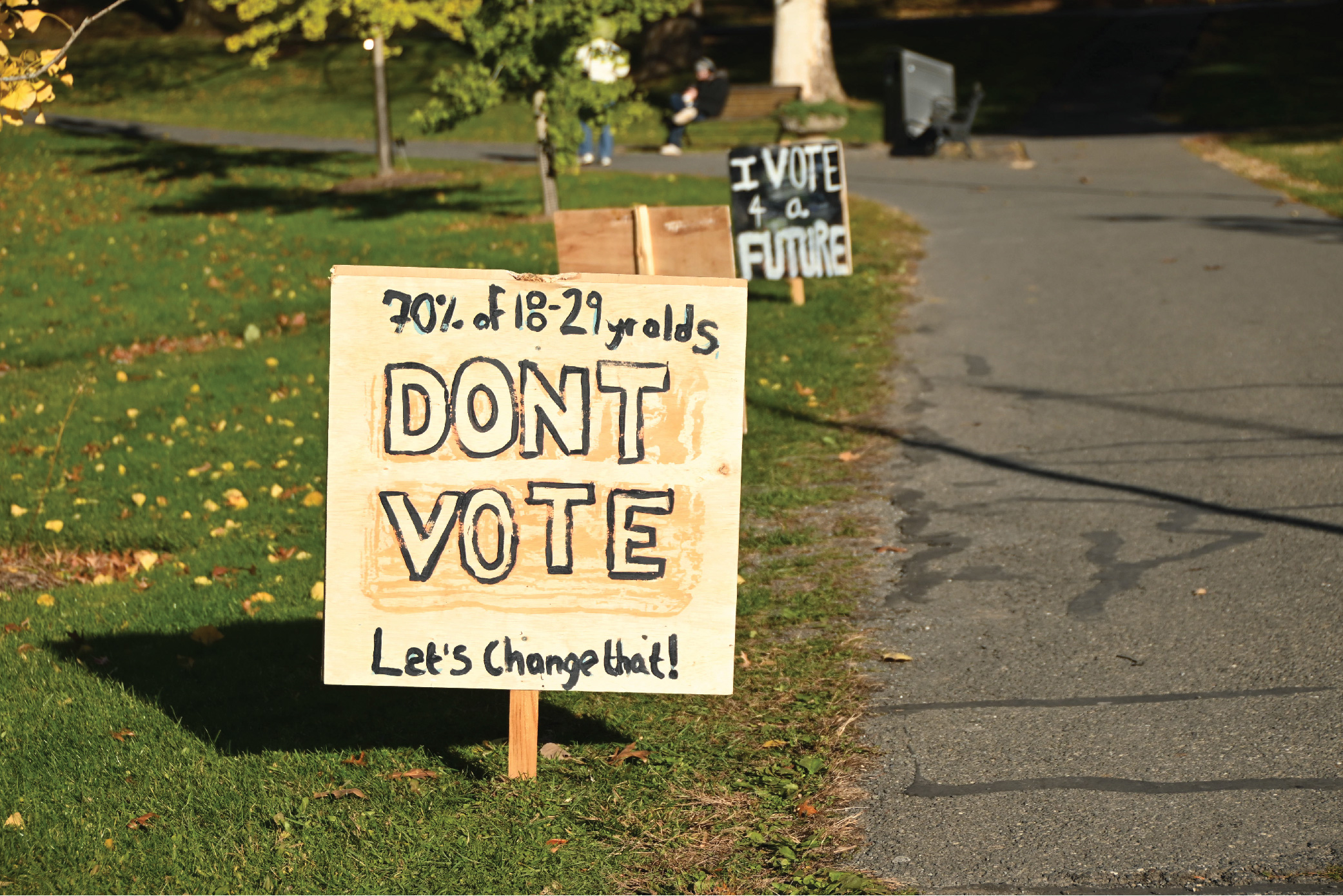 Close-up on a sign that reads "70% of 18-29 year olds DON'T VOTE. Let's change that!