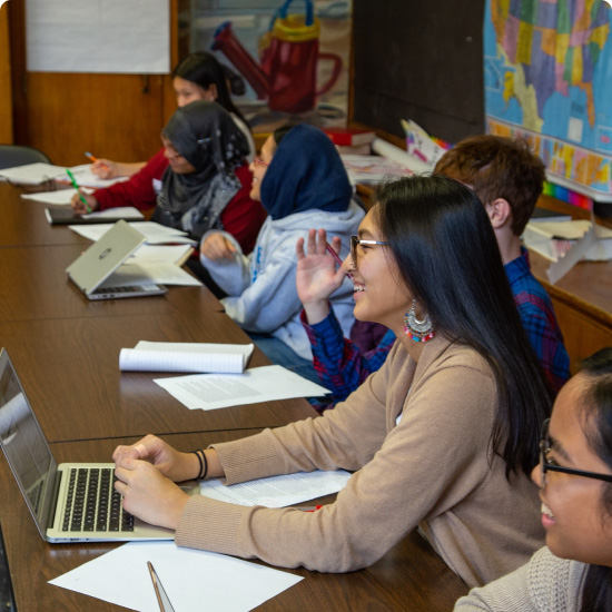 Students in a classroom in discussion at BHSEC Manhattan.