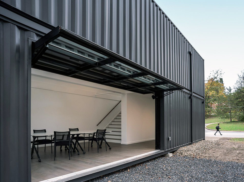 New Annandale House, with garage door open to the outside. Photo: (c) MB Architecture.