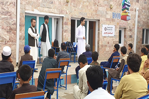 Slide depicting activities from AUCA student Abdul Walid Azizi&#39;s project, Camp Afghanistan