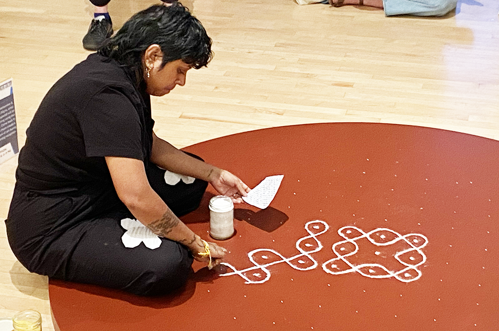 Aarati Akkapeddi&#39;s live performance piece &ldquo;Swarajyalaxmi&rdquo; involved creating a kolam,&nbsp;a traditional South Indian decorative design, on the floor of the Opalka Gallery in Albany. Photo by Terry Roethlein