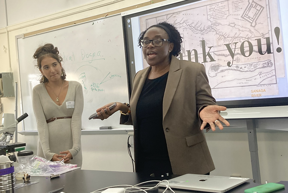 BHSEC Manhattan faculty member Ursula Embola&nbsp;(right) and student Laura-Albane Peyronnet present research at BHSEC Bronx during the Summit on Mobility and Immobility. Photo courtesy of BHSEC.