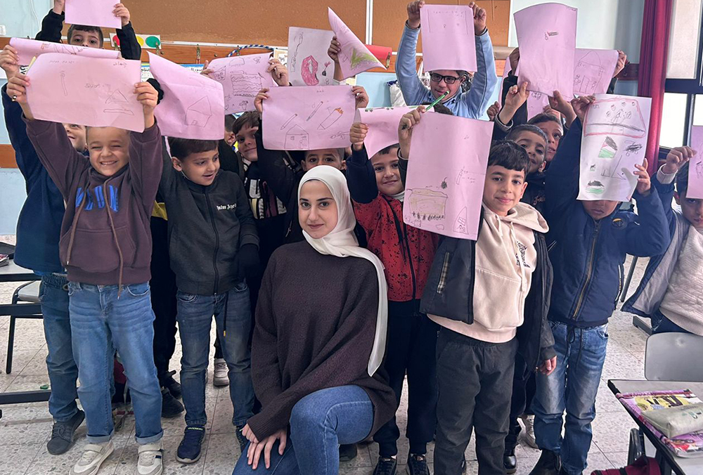 Haneen Jarrad poses for a group portrait with her students in Tulkarem, West Bank. Photo courtesy of Haneen Jarrad.