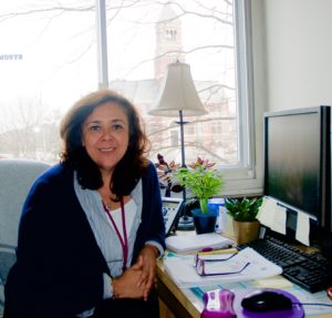 <em>Tatiana Rojas at her Kingston High School main office. Photo by Antonio Flores-Lobos.</em>